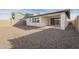 Landscaped backyard with gravel and covered patio at 12028 N Luckenbach St, Surprise, AZ 85388