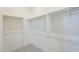 Large walk-in closet with double hanging rods at 12028 N Luckenbach St, Surprise, AZ 85388