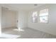 Bright and airy entryway with tile flooring and access to the main living area at 12028 N Luckenbach St, Surprise, AZ 85388