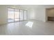 Living room with sliding glass doors and wood cabinets at 12028 N Luckenbach St, Surprise, AZ 85388