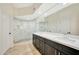 Elegant bathroom with double vanity, frameless shower, and modern fixtures at 13503 E Charter Oak Dr, Scottsdale, AZ 85259