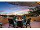 Relaxing patio with fire pit and panoramic mountain views at 13503 E Charter Oak Dr, Scottsdale, AZ 85259