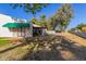 Sprawling backyard featuring a covered patio, mature trees, and lush greenery, perfect for outdoor enjoyment at 15233 N 5Th Ave, Phoenix, AZ 85023