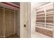 Spacious walk-in closet providing ample storage with built in shelving and dual access at 15233 N 5Th Ave, Phoenix, AZ 85023