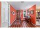 Foyer with wood door, tile floor and red walls with decorative accents at 15233 N 5Th Ave, Phoenix, AZ 85023