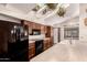 Bright kitchen boasts stainless steel appliances, ample counter space, and hanging plants for natural decor at 15233 N 5Th Ave, Phoenix, AZ 85023