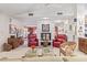 Bright living space featuring a fireplace and multiple seating areas at 15233 N 5Th Ave, Phoenix, AZ 85023