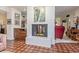 Cozy living room featuring a fireplace, and tiled flooring throughout at 15233 N 5Th Ave, Phoenix, AZ 85023