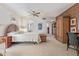 Comfortable main bedroom featuring a ceiling fan, wardrobe and stylish woven furniture at 15233 N 5Th Ave, Phoenix, AZ 85023
