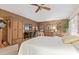 Inviting main bedroom with a ceiling fan, sitting area, ample dresser and woven furniture at 15233 N 5Th Ave, Phoenix, AZ 85023