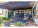 Charming patio with a shaded pergola, outdoor seating, and a built-in gas grill at 15233 N 5Th Ave, Phoenix, AZ 85023