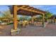 Community grilling station with tables and pergola at 17408 N 96Th Way, Scottsdale, AZ 85255