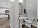 Powder room with pedestal sink and toilet at 17408 N 96Th Way, Scottsdale, AZ 85255