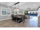 Open dining area with large table, sliding doors to backyard and pool at 17408 N 96Th Way, Scottsdale, AZ 85255