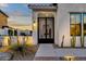 Modern front entrance with iron gate and pathway at 17408 N 96Th Way, Scottsdale, AZ 85255