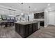 Open kitchen island with granite countertops and stainless steel dishwasher at 17408 N 96Th Way, Scottsdale, AZ 85255