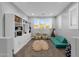 Playroom features built-in shelving, a sofa, and a rug at 17408 N 96Th Way, Scottsdale, AZ 85255