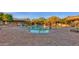 Community pool area with cabanas and lounge chairs at 17408 N 96Th Way, Scottsdale, AZ 85255