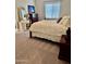 Cozy bedroom with a decorative bed frame, a makeup table and a window with blinds at 20668 E Sunset Dr, Queen Creek, AZ 85142