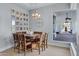 Breakfast nook features wood table, chairs, and picture gallery wall at 20668 E Sunset Dr, Queen Creek, AZ 85142