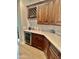 Elegant kitchen area featuring custom cabinets, a wine rack, and a built-in wine fridge at 20668 E Sunset Dr, Queen Creek, AZ 85142