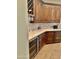 Stylish kitchen area featuring custom cabinets, marble countertops, and a built-in wine fridge at 20668 E Sunset Dr, Queen Creek, AZ 85142