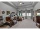 Spacious main bedroom with plush seating and large windows at 20668 E Sunset Dr, Queen Creek, AZ 85142