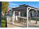 Outdoor patio with gazebo, dining area, and built-in grill at 20668 E Sunset Dr, Queen Creek, AZ 85142