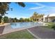 Relaxing pool area with spacious patio and lush greenery at 20668 E Sunset Dr, Queen Creek, AZ 85142