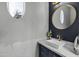 Powder room with a modern sink and elegant fixtures at 20668 E Sunset Dr, Queen Creek, AZ 85142