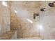 Shower with beige tile and built-in shelving at 20668 E Sunset Dr, Queen Creek, AZ 85142