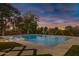 Inviting swimming pool with water features at sunset at 20668 E Sunset Dr, Queen Creek, AZ 85142