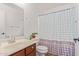 Clean bathroom with a shower/tub and polka dot curtain at 306 N 21St Cir, Coolidge, AZ 85128