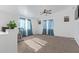 Spacious bonus room with carpeted floor and exercise bike at 306 N 21St Cir, Coolidge, AZ 85128