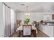 Dining area with six chairs and a kitchen view at 306 N 21St Cir, Coolidge, AZ 85128