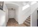 Bright entryway with tile flooring and neutral colors, leading to staircase at 306 N 21St Cir, Coolidge, AZ 85128