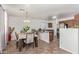 Open kitchen with dark wood cabinets and an island at 306 N 21St Cir, Coolidge, AZ 85128