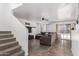 Spacious living room with tile flooring and sliding glass doors at 306 N 21St Cir, Coolidge, AZ 85128