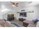 Bright living room featuring a large TV and comfortable seating at 306 N 21St Cir, Coolidge, AZ 85128