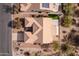 Bird's-eye view of a residence with solar panels, a putting green, and desert landscaping at 5217 S Crested Saguaro Ln, Gold Canyon, AZ 85118