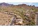 Panoramic aerial view showcasing the community, desert landscape and distant mountains at 5217 S Crested Saguaro Ln, Gold Canyon, AZ 85118