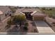 Beautiful aerial view of single story house with desert landscaping and concrete driveway, showcasing the neighborhood at 5217 S Crested Saguaro Ln, Gold Canyon, AZ 85118