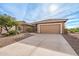 Charming single-story home boasts a well-manicured yard and inviting curb appeal, perfect for comfortable living at 5217 S Crested Saguaro Ln, Gold Canyon, AZ 85118