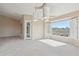 Inviting living room boasts neutral tones, carpeted floors, and large windows framing scenic outdoor views at 5217 S Crested Saguaro Ln, Gold Canyon, AZ 85118