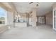 Open-concept living area connects to kitchen, offering ample space with neutral tones and natural light at 5217 S Crested Saguaro Ln, Gold Canyon, AZ 85118