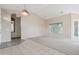 Bright living room with carpet and tile flooring, ceiling fan, and access to a patio, providing ample light at 5217 S Crested Saguaro Ln, Gold Canyon, AZ 85118