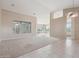 Bright living room with carpet and tile flooring, ceiling fan, and a large window offering beautiful outside views at 5217 S Crested Saguaro Ln, Gold Canyon, AZ 85118