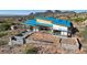 Aerial view of a new modern home's construction, featuring a pool and hillside location at 9609 N Palisades Blvd, Fountain Hills, AZ 85268