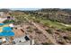 Aerial view of a house under construction, situated on a hillside overlooking a golf course at 9609 N Palisades Blvd, Fountain Hills, AZ 85268