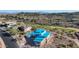 Aerial view of a new home under construction, situated on a hillside overlooking a golf course at 9609 N Palisades Blvd, Fountain Hills, AZ 85268